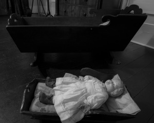 Antique doll and crib at Pond Spring. (photo by Marjorie Kaufman)
